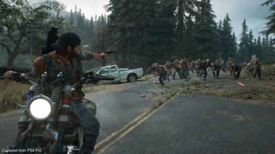 Days Gone - Deacon on his bike shooting freakers