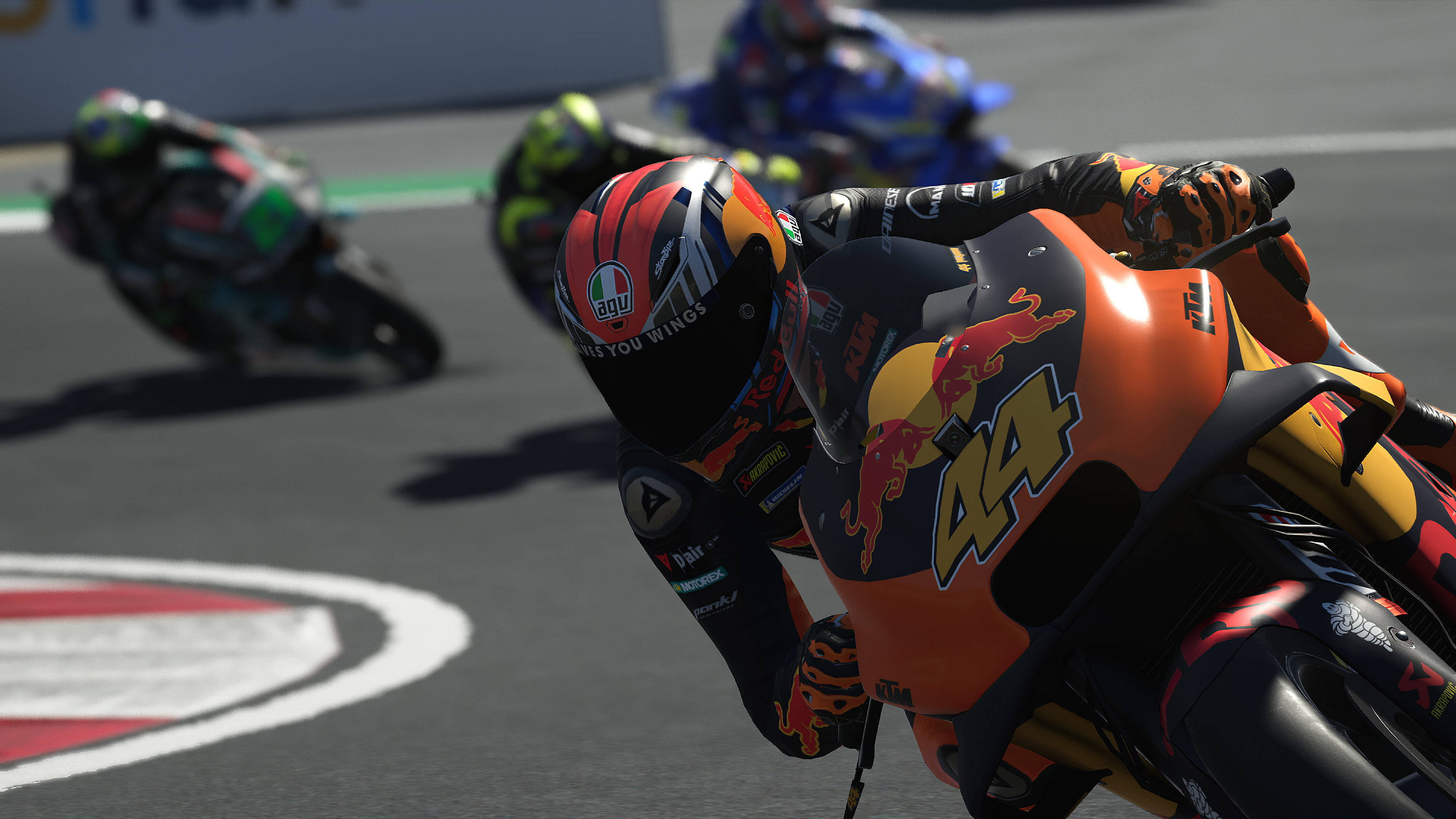 MotoGP™20 - Close of up racer, two behind them